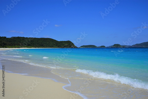 Beautiful summer scenery. calm waves on the blue water. Furuzamami Beach in Zamami island, Okinawa, Japan - 日本 沖縄 座間味島 古座間味ビーチ 青い海  © Eric Akashi