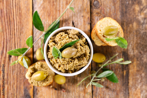 green olive tapenade and tree branch