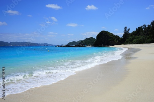 Beautiful summer scenery. calm waves on the blue water. Furuzamami Beach in Zamami island  Okinawa  Japan -                                                            