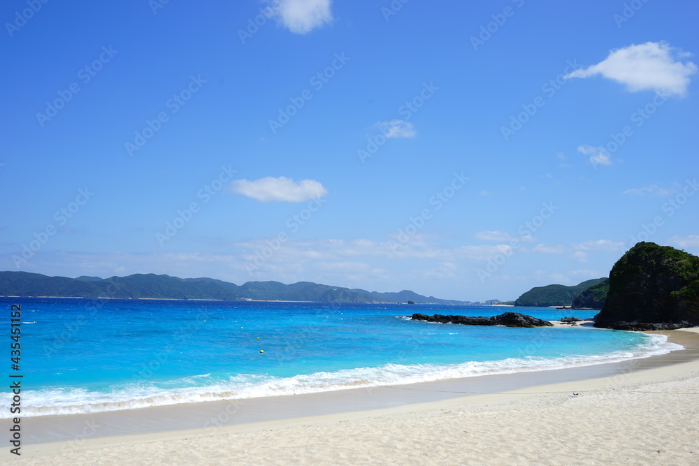 Beautiful summer scenery. calm waves on the blue water. Furuzamami Beach in Zamami island, Okinawa, Japan - 日本 沖縄 座間味島 古座間味ビーチ 青い海 Beautiful summer scenery. calm waves on the blue water. Furuzamami Beach in Zamami island, Okinawa, Japan - 日本 沖縄 座間味島 古座間味ビーチ 青い海
