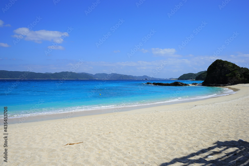 Beautiful summer scenery. calm waves on the blue water. Furuzamami Beach in Zamami island, Okinawa, Japan - 日本 沖縄 座間味島 古座間味ビーチ 青い海	