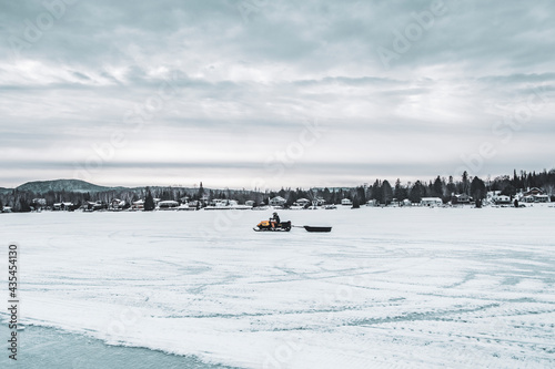 Snowmobile on frozen lake