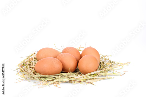 Fresh eggs from organic farms on rice straw Isolated on white background