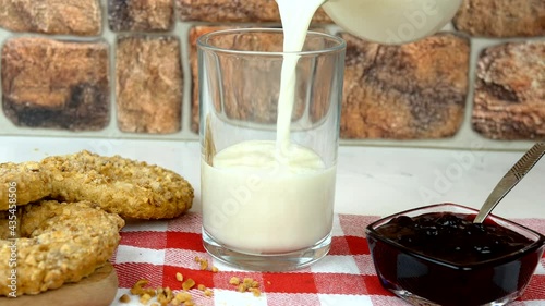 Fresh natural milk is poured into glass. photo