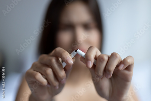 woman trying to stop smoking, concept of world no tobacco day, quit smoking, female smoker, secondhand smoking