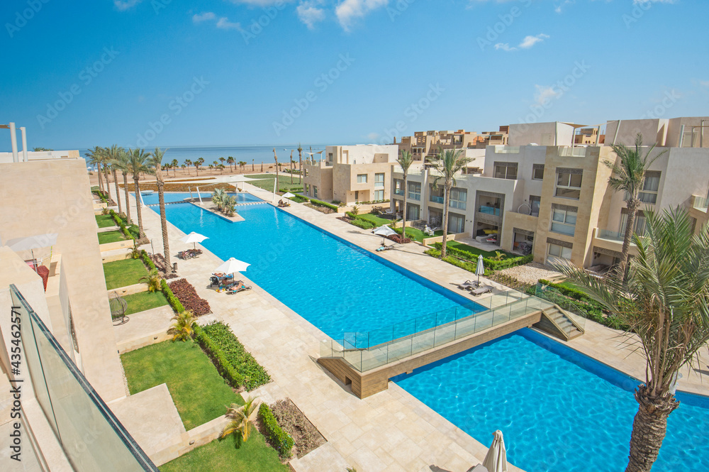 Swimming pool in a luxury tropical hotel resort with sea view