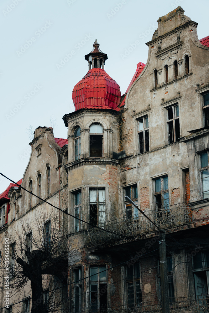 Fototapeta premium An old historic abandoned house with turrets and decorative ornaments on the facade. One of the main attractions of the city of Sovetsk, Kaliningrad Region