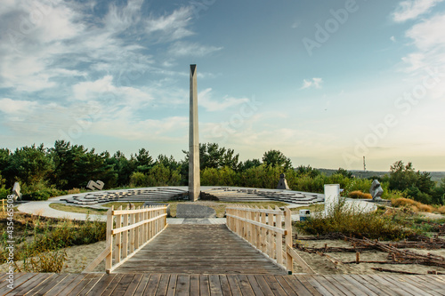 Outdoor horizontal sundial-a calendar standing on the Parnidis dune near Nida,Curonian Spit, Lithuania.Decorative granite sculpture,natural monument, popular tourist attraction in the Baltics photo