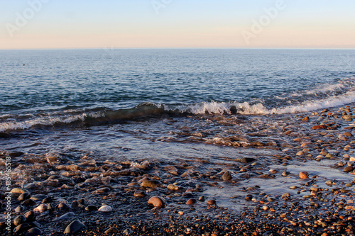 relaxing image of a sea coast in sunset warm colors. Summertime background idea