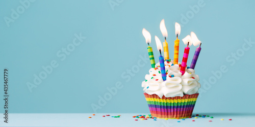Birthday cupcake with lots of colorful candles