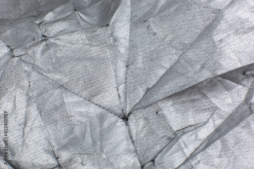 Gray Crumpled braided cotton net texture background. Close up.