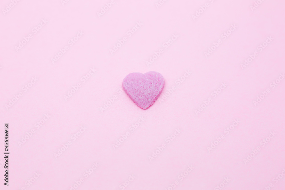 Pink heart on pink background. Saint Valentine's day concept. Love and romantic photo. Postcard for holiday. Beautiful warm wallpaper with love. Soft focus. Copy space.