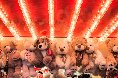 Stuffed toy bears on display awarded as winning prizes at Christmas funfair winter wonderland in London