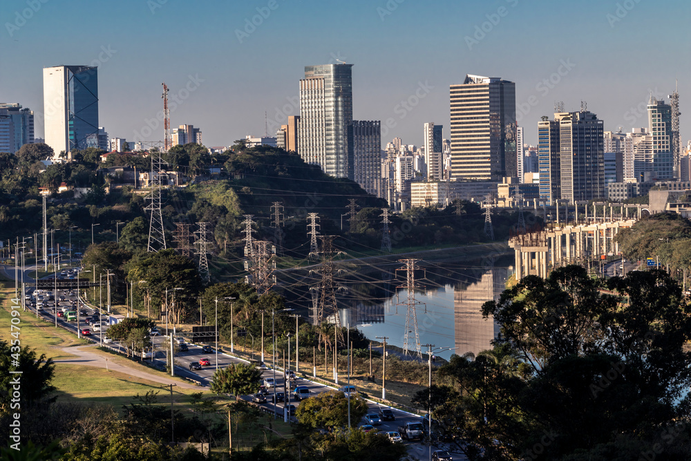 Fototapeta premium City skyline, with Marginal Avenue and Pinheiros River in the foreground, in the south zone of Sao Paulo, Brazil