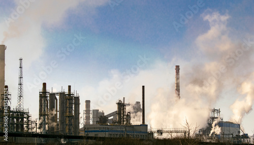 Industrial plant with smog emissions. Ecological concept. 