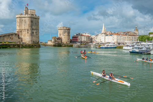 Tourists in sea kayaks in old harbour at La Rochelle, Charente-Maritime on west Atlantic coast France