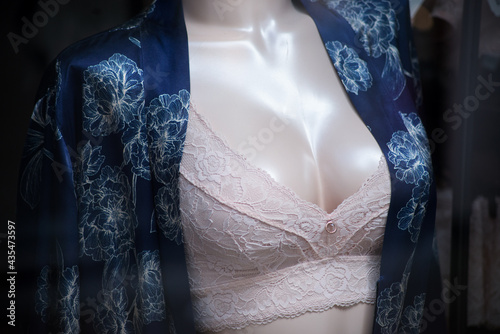 Closeup of white bra on mannequin in a fashion store showroom