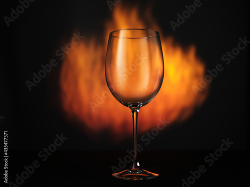 Empty glass of wine on fire background