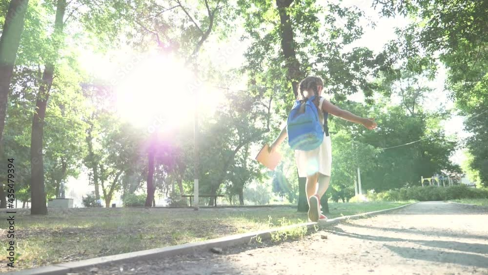 Schoolgirl run to school in park. Little girl with a backpack run to school. Schoolgirl with a book through park to school. Schoolgirl with a backpack run to school. Schoolgirl run to school in park. Little girl with a backpack run to school. Schoolgirl with a book through park to school. Schoolgirl with a backpack run to school.