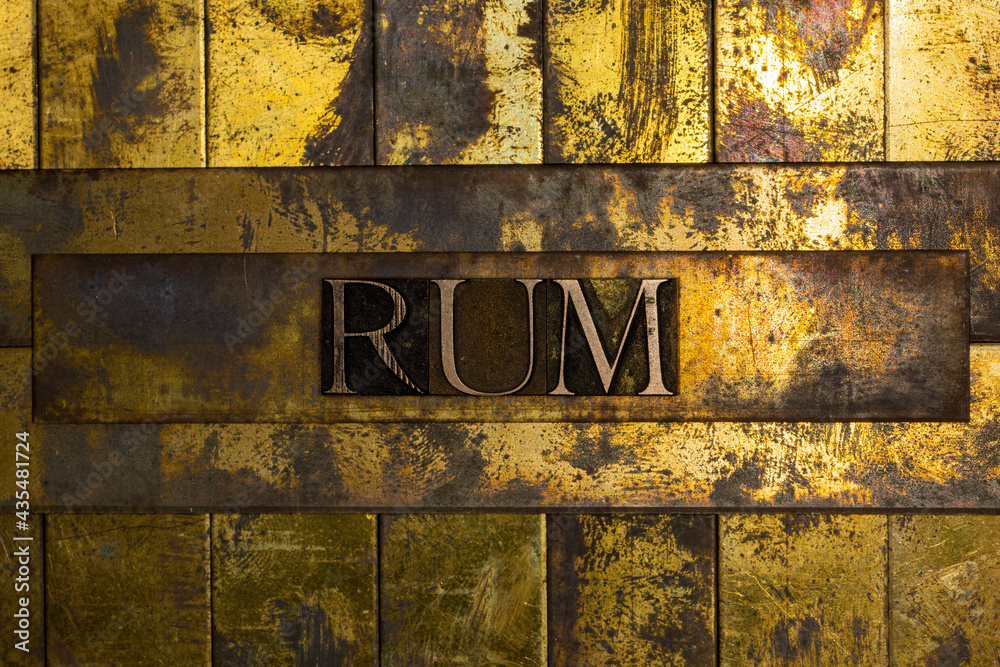 Rum text on textured copper and gold background