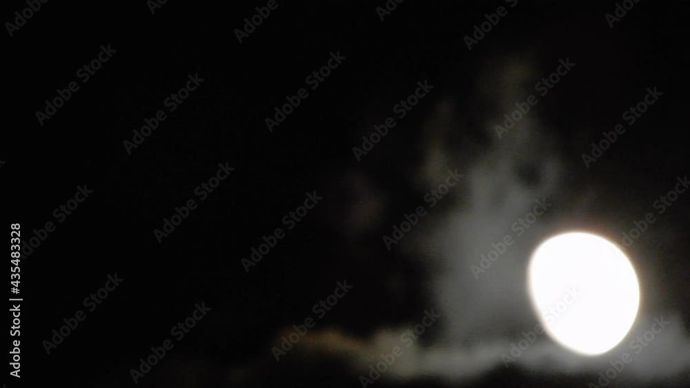 Blurred Moon Reveal In Night Sky With Gray Clouds Blurred Moon Reveal In Night Sky With Gray Clouds