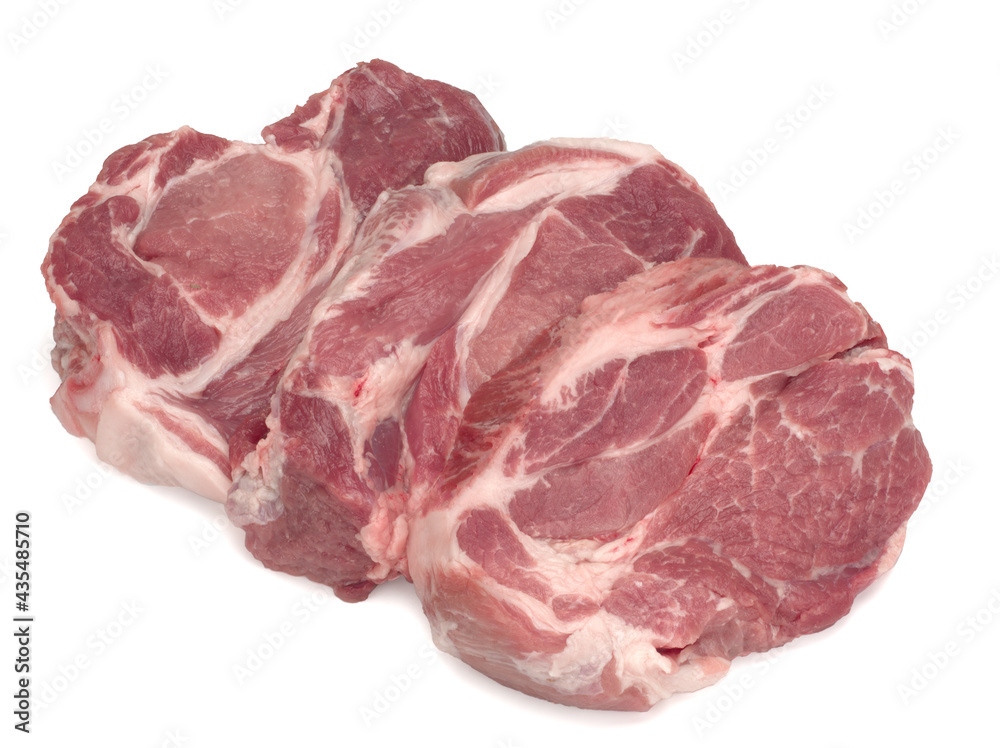 Three raw pork neck meat cuts on a white Three raw pork neck meat cuts on a white