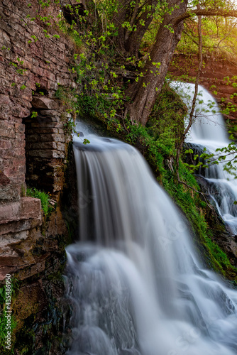Beautiful waterfall in the canyon in spring. Dzhurinsky waterfall