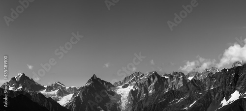 Panorama of high rocky mountains with snow and glacier
