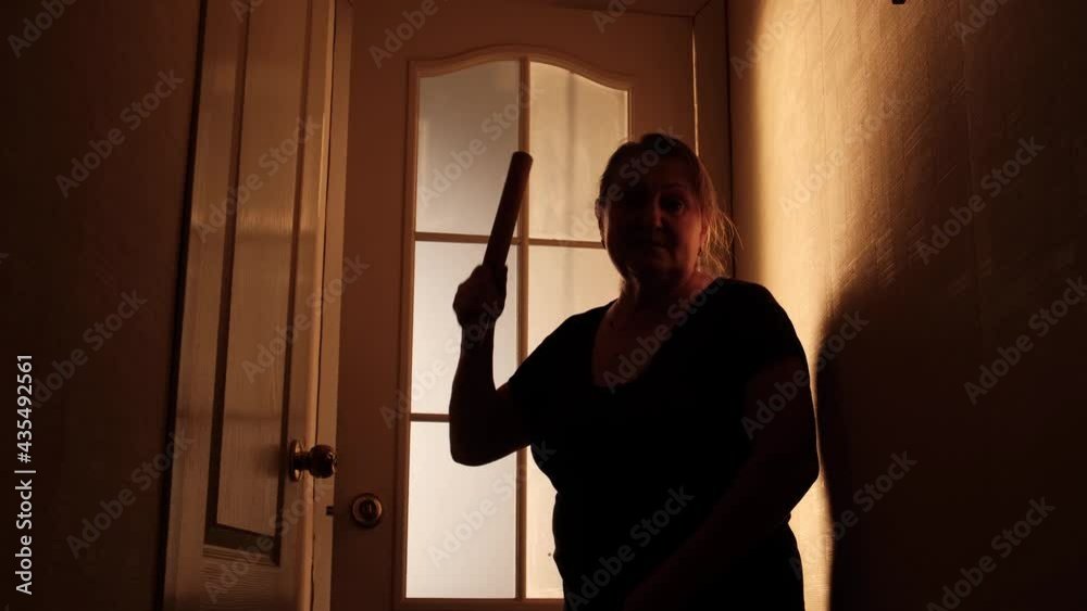 Angry wife or stepmom screams and threatens rolling pin