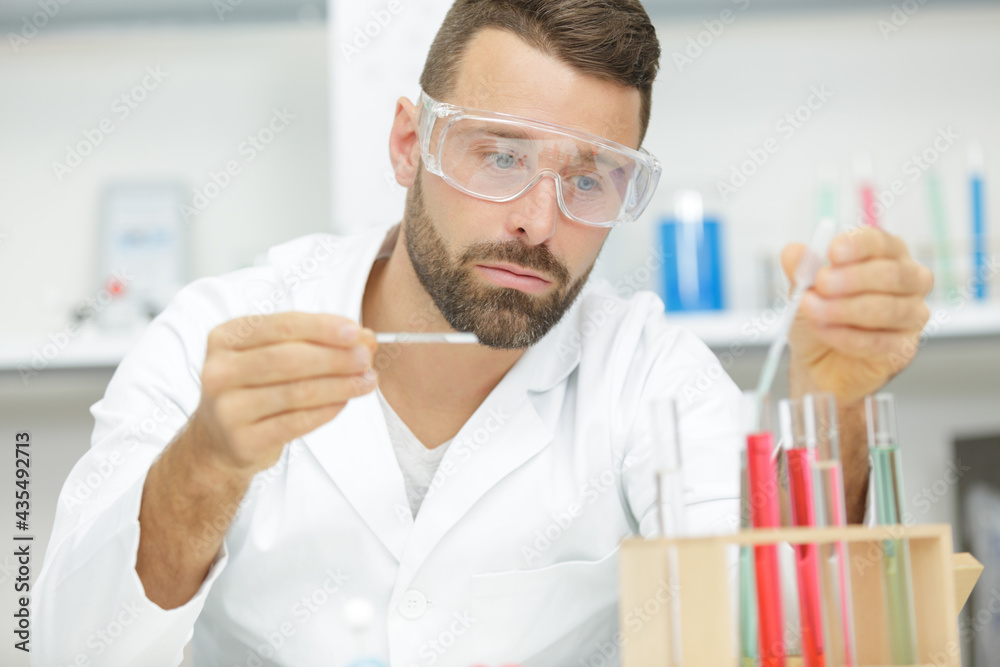 young biologist sets dna sequencing reaction with multichannel pipette young biologist sets dna sequencing reaction with multichannel pipette