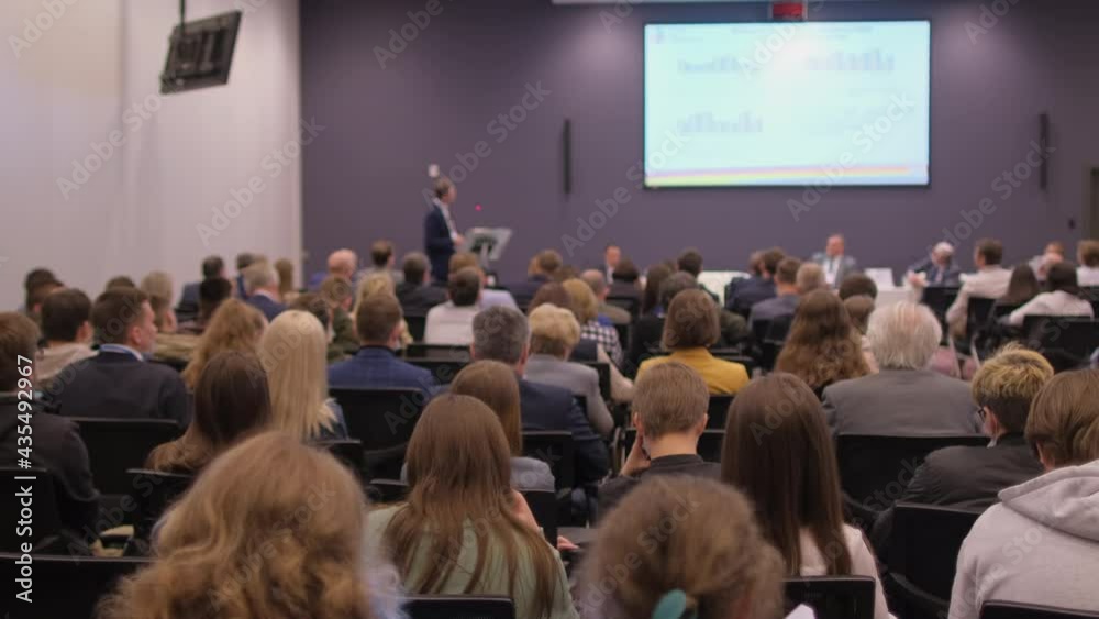 Group of people listening lecture seminar of coach speaker with display screen stage. Audience conference congress forum presentation business training businessman education learn, Listening to speech