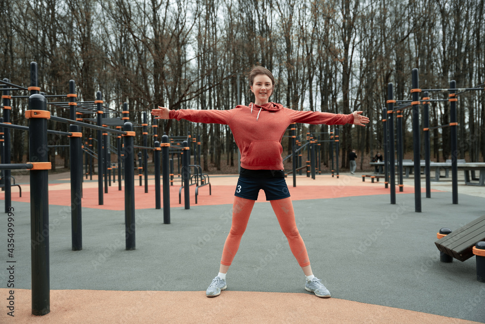 Fitness sport young woman in fashion sportswear  exercising in the park 
