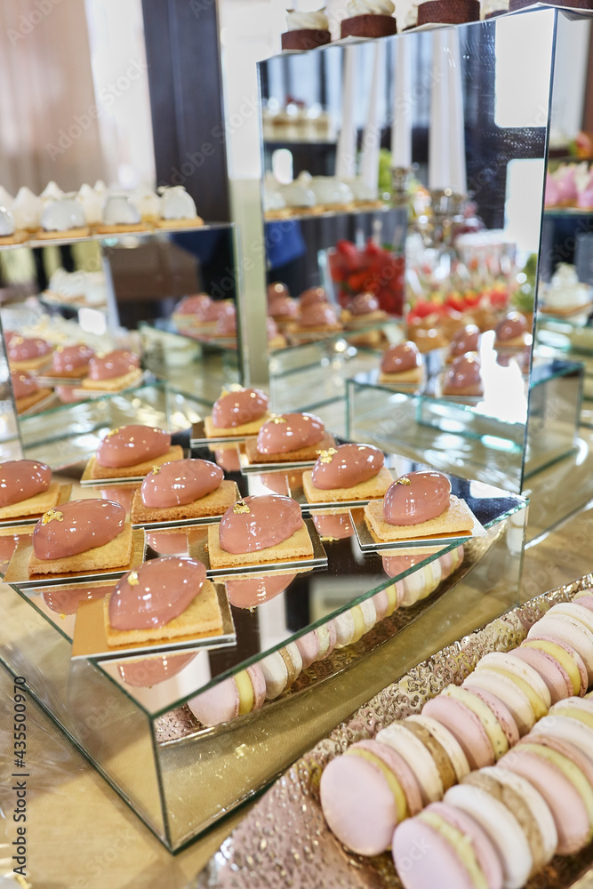 Festive sweet table. Cakes with cakes, cookies and mousses