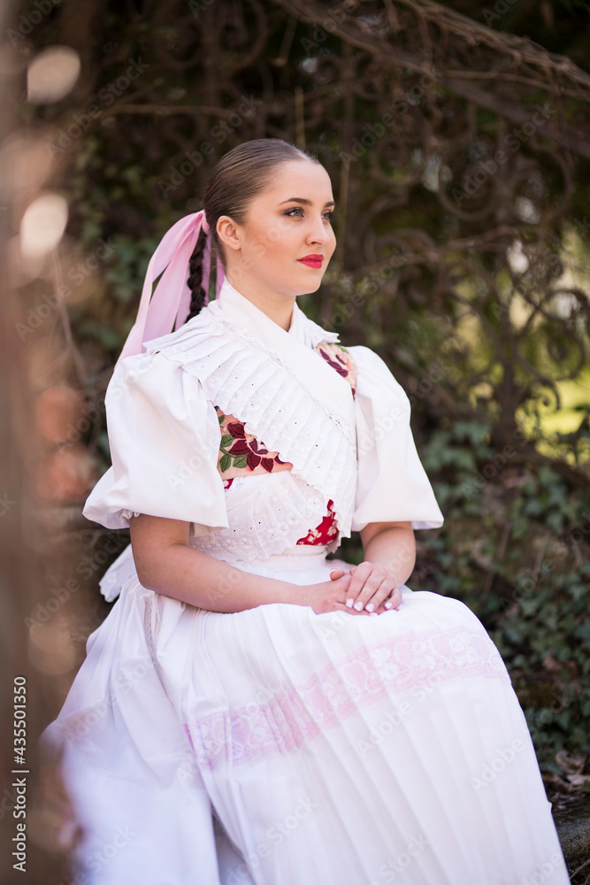 Young beautiful slovak woman in traditional dress. Slovak folklore Young beautiful slovak woman in traditional dress. Slovak folklore
