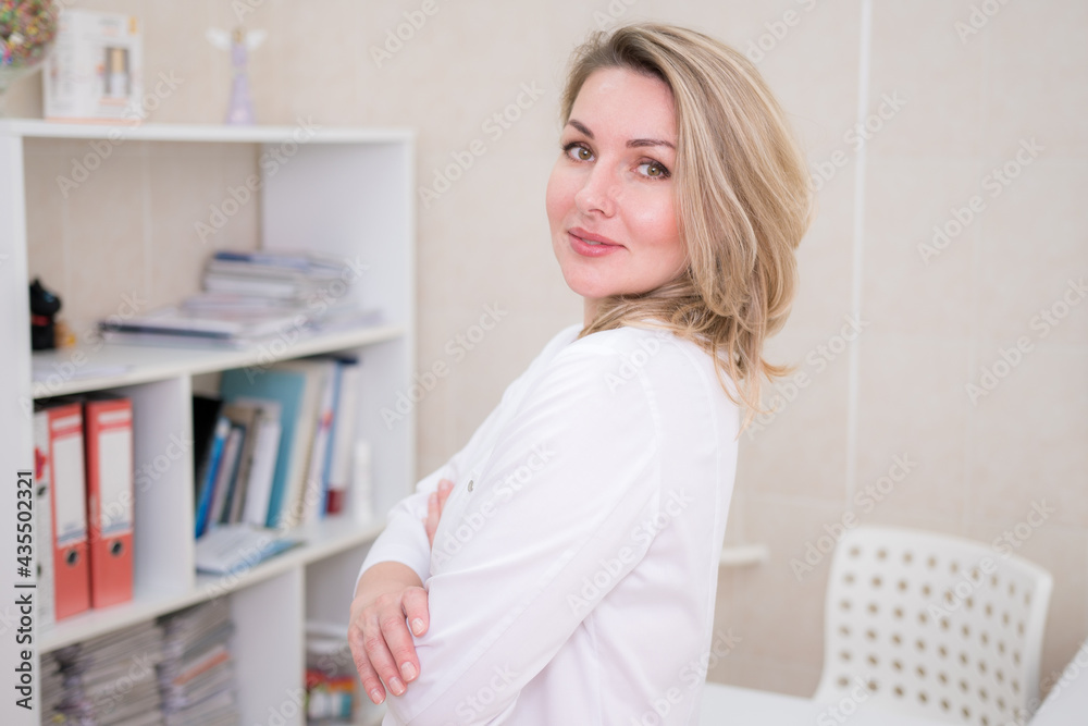 Portrait of female doctor wearing white formal wear