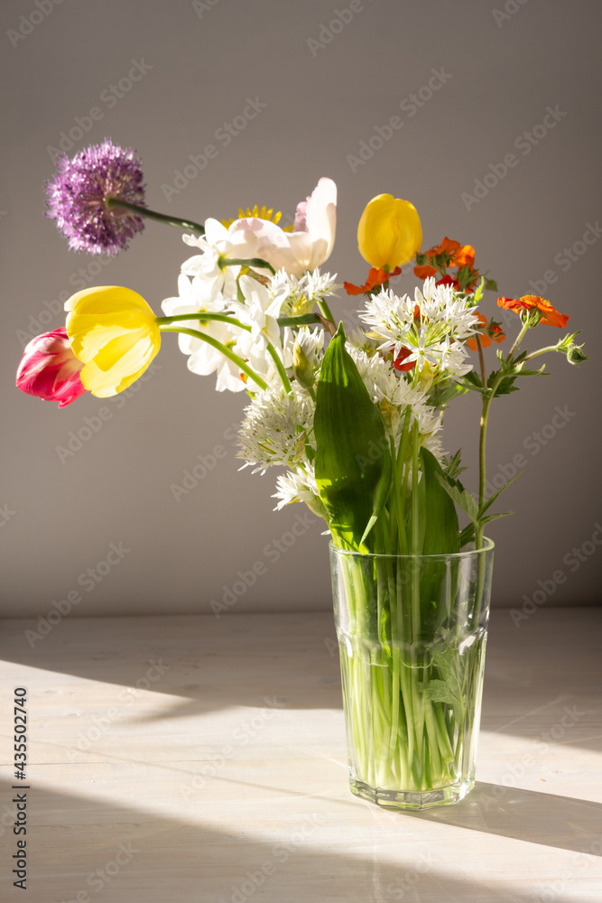 bouquet of colorful bright garden flowers in vase in sun light on white table bouquet of colorful bright garden flowers in vase in sun light on white table