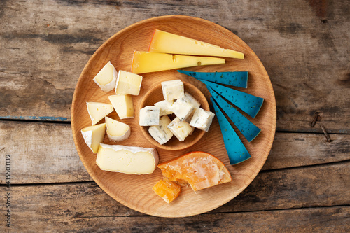 Top view of set cheese board on wooden background