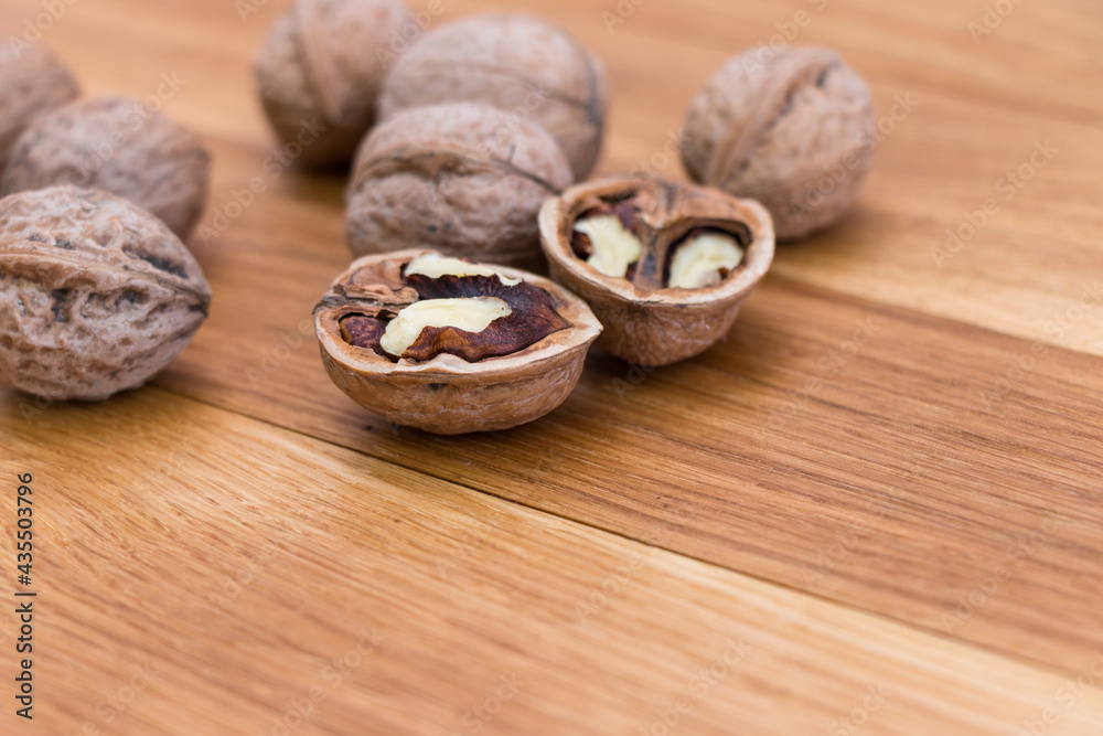 Ripe walnuts on wooden rustic backdrop. Healthy nut food for brain. Fresh walnuts background concept
