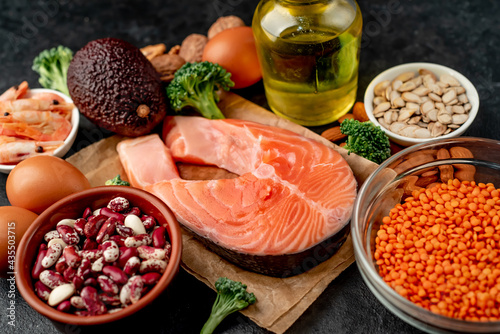 Different foods sources of omega-3 acids on a stone background