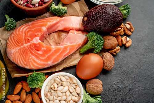 Different foods sources of omega-3 acids on a stone background