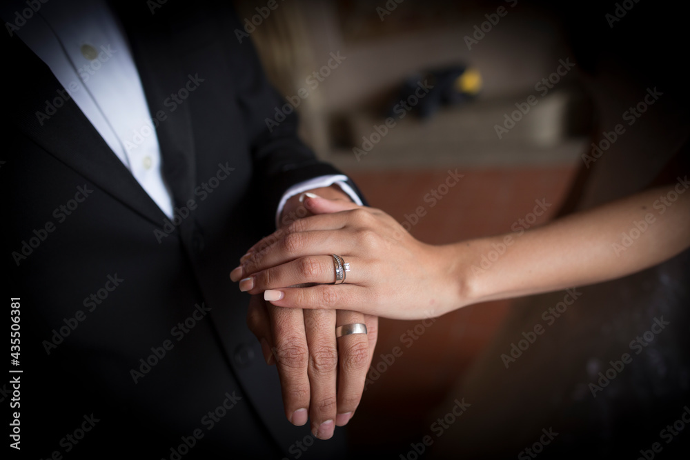close up of rings in a wedding ceremony