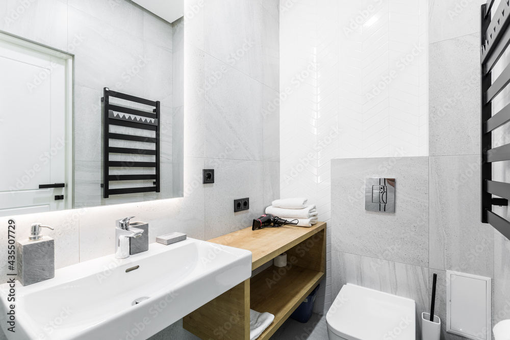 interior photo, small bathroom, with white marble tiles, and shower