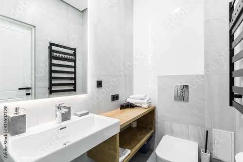 interior photo  small bathroom  with white marble tiles  and shower