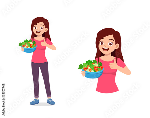 young good looking woman eat fruit and vegetable