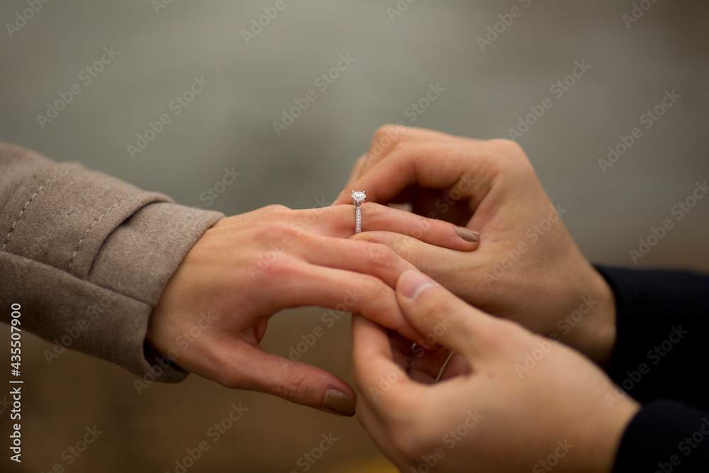 close up of a man presenting his girlfriend with an engagement ring close up of a man presenting his girlfriend with an engagement ring