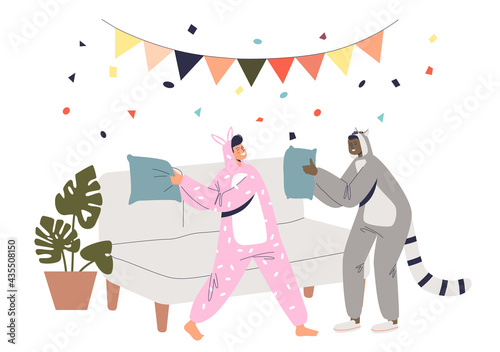 Kigurumi party with funny boy and girl in bunny and raccoon costumes fighting pillows
