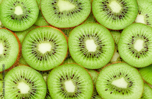 background of fresh sliced kiwi fruit close up