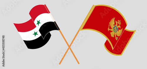 Crossed and waving flags of Syria and Montenegro