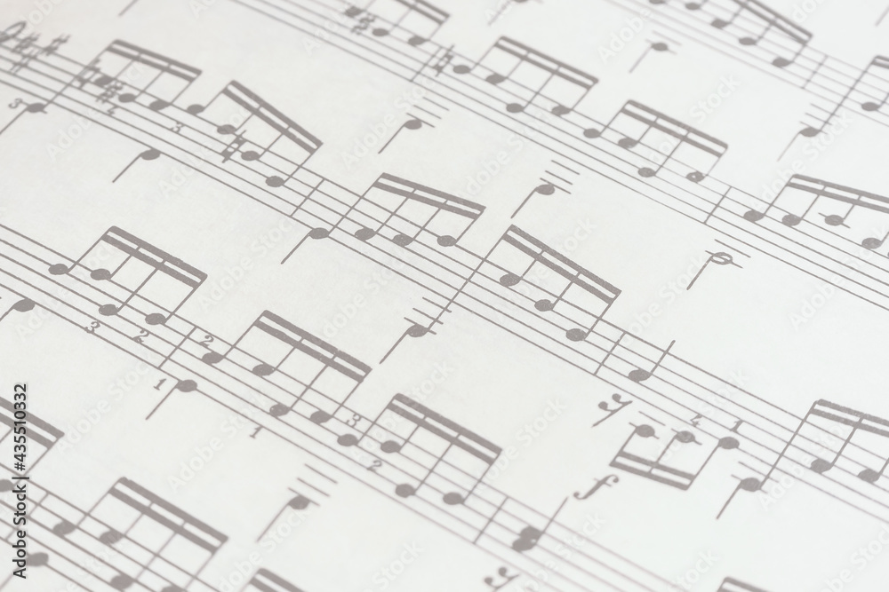 Paper sheet with musical notes, scales and exercises, desaturated Paper sheet with musical notes, scales and exercises, desaturated