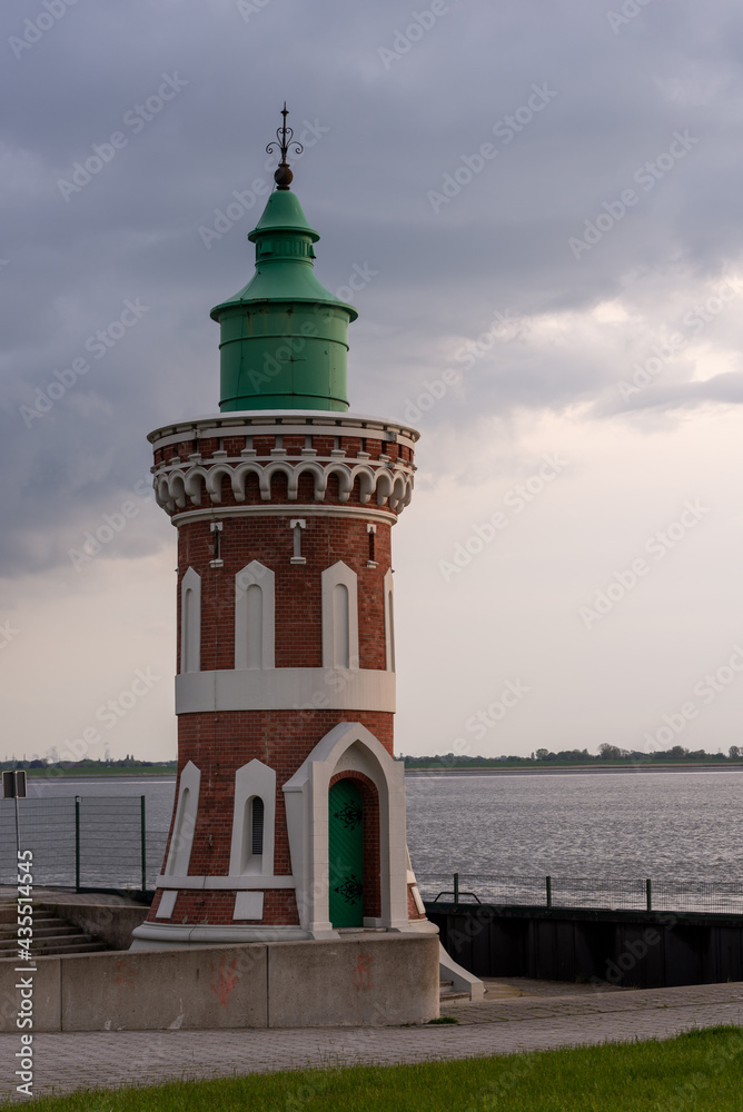 old lighthouse with cloudy sky